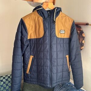 Howler Bros puffer jacket blue and orange